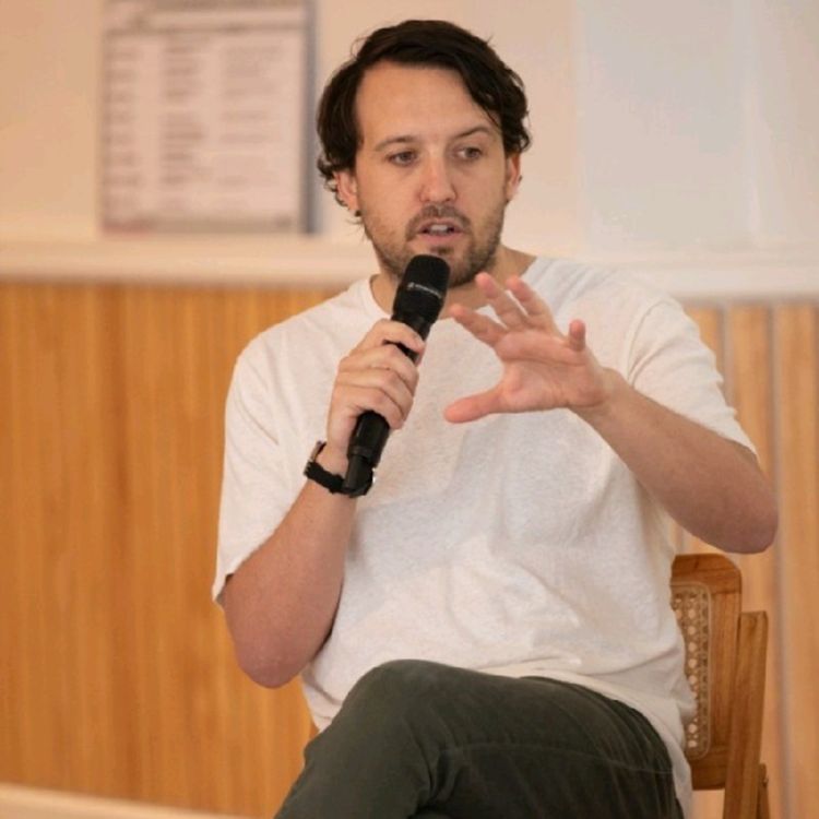 Booker Woodford, Fat Snag founder, mid-conversation holding a microphone